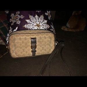 A small  beige canvas crossover LV .